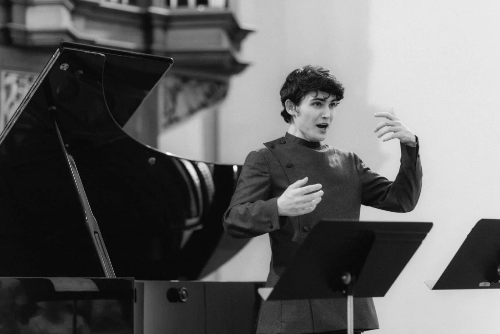 Gleb singing during a performance