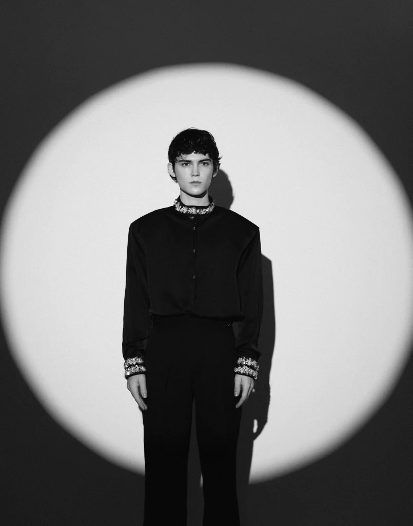 Gleb in a black outfit, studio portrait