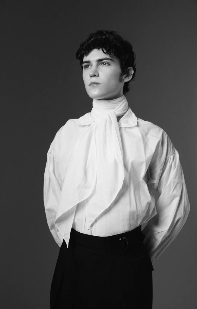 Gleb in a white shirt, studio portrait