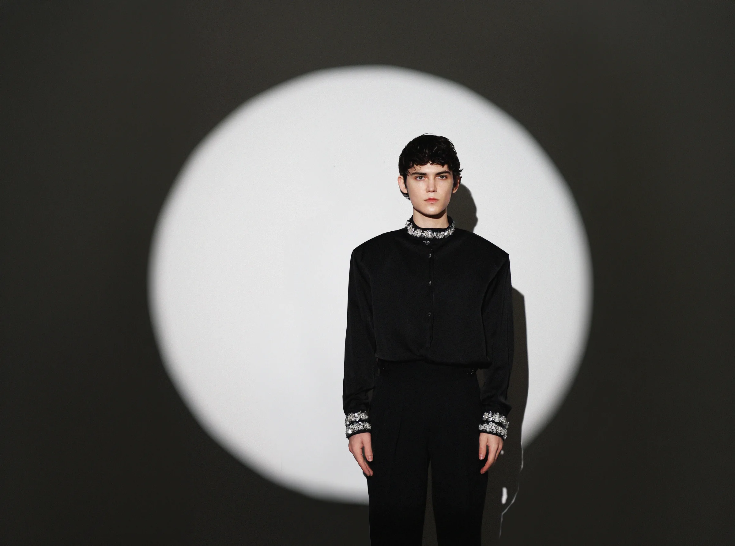 Gleb Zakharov in a black stage outfit